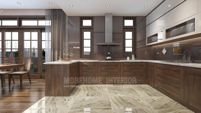 Mẫu tủ bếp màu nâu trầm ấn tượng từ gỗ óc chó, thiết kế liền bàn đảo hiện đại mang lại sự thuận tiện cho gia chủ trong quá trình nấu nướng và bày biện trang trí đồ ăn